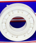 FULL Ceramic 6308 ZrO2/PTFE C3 FIT 40mm x 90mm x 23mm bearing, front view showing white ceramic structure and PTFE cage
