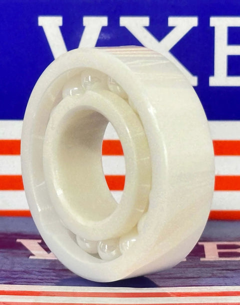 6004 Full Complement Full Ceramic Bearing 20x42x12mm ZrO2 on display with a colorful background.