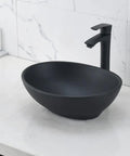 Black oval vessel sink with faucet and drain combo above counter bathroom sink porcelain vessel basin modern European design