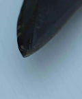 Close-up of the tip of a Wolf Sense Scythe Blade 70cm By 50mm Hand Forged In Austria With Double Peen Ready To Use Sharp 25 Inch Edge Beefy Austrian Steel
