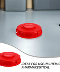 Two Pack Red Abs Ibc Container Lid Covers With Vent Holes And Valve Caps For Secure Sealing Quick Liquid Access Smooth Flow Protection On 550 Gallon Water Barrels on gray floor
