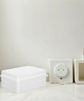 Solid 13 Piece IP65 Waterproof Junction Box Set For Outdoor Cable Wiring on a tiled floor against a wall.