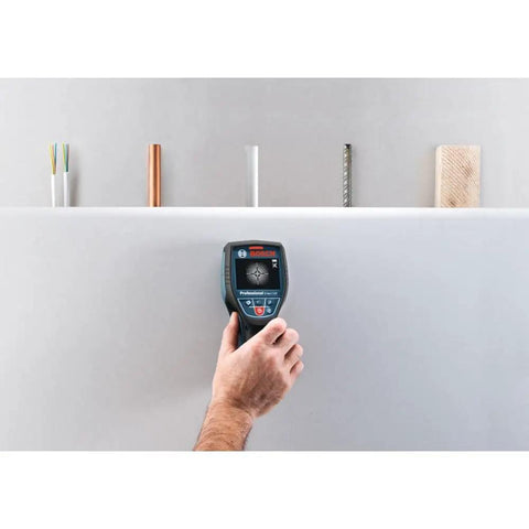 Bulletproof D-Tect120 Wall And Floor Scanner With Instant Radar Detection locating copper pipe and wiring on drywall.
