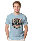 Classic Retro Mechanical Engineer Tee With Vintage Barn Garage Gear Badge Design For Hands-On Builders And Tool Loving Tinkerers In 100 Cotton worn by a smiling man.