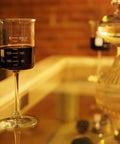 Beaker Style Wine Glasses Four Pack Lab Themed Stemware Hand Blown Clear Glass Graduated To 200 Ml But Holds A 300 Ml Pour on table