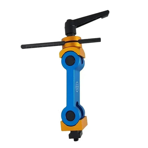 Universal Adjustable CNC Mill And Lathe Work Stop Positioner Featuring Rock Solid Multi Function Locator Tool For Quick Bench Setup and Dead Nuts Accurate Clamping Daily, blue and orange tool with adjustable arms.