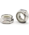 Bulletproof 3/4-16 Nylon Jam Lock Nuts Machined From Premium 18-8 Stainless Steel Thin Self Locking Hardware With Vibration Resistant Grip Built For Rugged Shop Work And Heavy Duty Builds Case Of Two Five Zero close-up view of two low profile lock nuts.