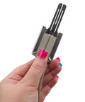 Hand holding WB13X25633 Glowbar Gas Range Igniter Replacement, beige and metal, model specific not universal