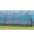 Xtender 36 Ft Batting Cage With Fiberglass Arch Frame And Polyester Netting shown in use on a grassy field