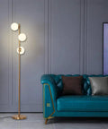 Three Globe Brushed Brass Floor Lamp, Modern LED Standing Light For Living Room, Bedroom, And Office with frosted globes