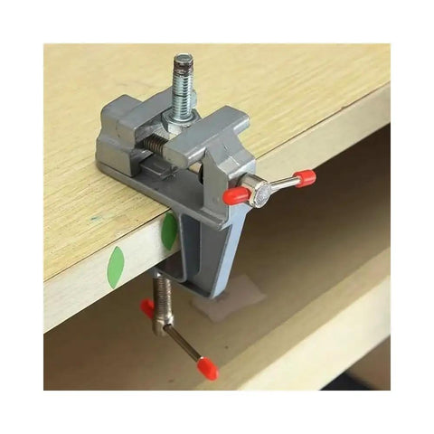 Solid Mini Workbench Vise Rig With A Three Point Five Inch Heavy Aluminum Jaw Precision Clamping Tool For Jewelry Crafts setup on a wooden surface.
