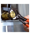 Cobra Water Pump Pliers 10 Inch with self-locking grip adjusting brass nut, showcasing precision and heavy-duty use.