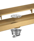 Top Shelf Linear Shower Drain With Removable Hair Catcher Grate And Brushed Gold Finish showing stainless steel body and quick drain design.