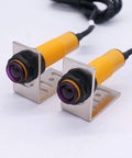 Dual M18 infrared photoelectric sensors with mounting brackets, PNP NO, DC 6-36V, 5m range, through-beam and reflective capabilities