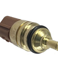 Coolant temperature sensor close-up: brass body with brown plastic connector and black O-ring