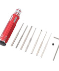 Badass Complete Tungsten Scriber Kit With Grippy Aluminum Handle And Seven Ultra Fine Replacement Blades Plus Wrench laid out on a white background.