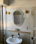 Industrial Vintage Slope Pole Wall Mount Sconce Light Fixture With Six Point Seven Inch Oval Clear Glass Shade In Antique Gold Finish for bathroom