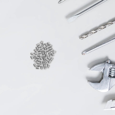 Fifty Pieces Of Heavy Duty Stainless Steel Dowel Pins Perfect For Cabinet Shelves And Metal Support Repairs on white background.