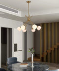 Six Light Sputnik Pendant Light Modern Mid Century Chandelier in dining room with rotatable arms, gold finish.