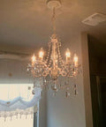Original Brink House 5 Light Crystal White Chandelier, hardwired flush mount ceiling light with acrylic crystals in a room
