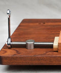 Adjustable Workbench Dog Clamp For Three Quarters Inch Holes Fits 19mm Posts Stainless Steel With Brass Adjustable Stop Keeps Workpieces Secure On Top Or At The Edge For Woodworking Be A Workhorse, side view on wooden bench