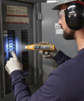 Electrician using 4 In 1 Breaker Finder, NCV Detector, Socket Tester And LED Flashlight in circuit panel for easy circuit location.