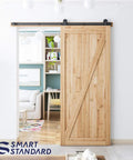 Rock Solid Six Foot Top Mount Sliding Barn Door Hardware Kit installed on wood door, living area view.