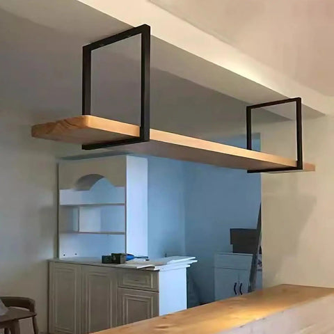 Heavy Duty Floating Shelf Bracket Set With Square Pipe Design And Secure Mounting Screws For Built Damn Tough Ceiling Support In Sleek Black above wooden shelf.