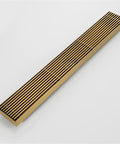 Top Shelf Slick Linear Shower Drain Stainless Steel Rectangle Floor Drain With Removable Grate Hair Catcher Bathroom High Flow Zero Fuss Easy Clean Gray Or Brushed Gold in brushed gold finish, angled view.