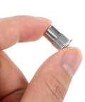 Get Your Hands On These 30pc Stainless Steel Flat Head Knurled Rivet Nuts That Are Totally Rad For Industrial And Metal Projects With Cool Corrosion Resistance, close-up of rivet nut held between fingers.