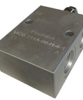 Inline hydraulic counterbalance load-holding valve block with four SAE-8 ports, gray metal body.