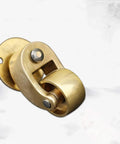 Premium Solid Brass Swivel Caster Wheels For Luggage And Rolling Gear 4 Piece Set close-up of a brass wheel and housing