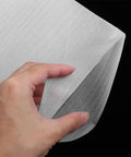 Close-up of a hand holding a white EPE foam pouch from the White EPE Foam Pouches 200 Pack For Packing And Shipping Cushioning And Shock Absorption