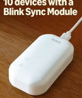 Sync Module Core for Outdoor 2K Plus Wireless Smart Security Camera With Sharp 2K Video, Black system on wooden surface