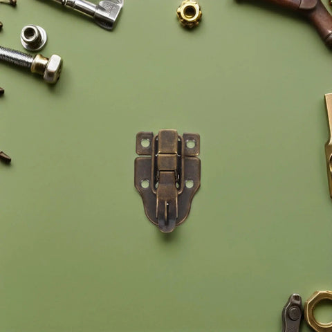 Cool 12 Pack Iron Wood Box Latches With Keyholes, Fancy Antique Toggle Buckles For Chests And Jewelry Boxes, Total Vibe Upgrade For Your Craft DIY Projects. Antique iron box latch with keyhole on green surface