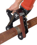Upgrade Your Angle Grinder With This Durable Belt Sander Adapter in use on a metal pipe, featuring a rubber grip and mixed alloy build.