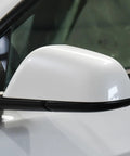 Fresh White Driver Side Mirror Lower Cover Replacement For Tesla Model 3 2017 To 2021 solid trim viewed from side angle.