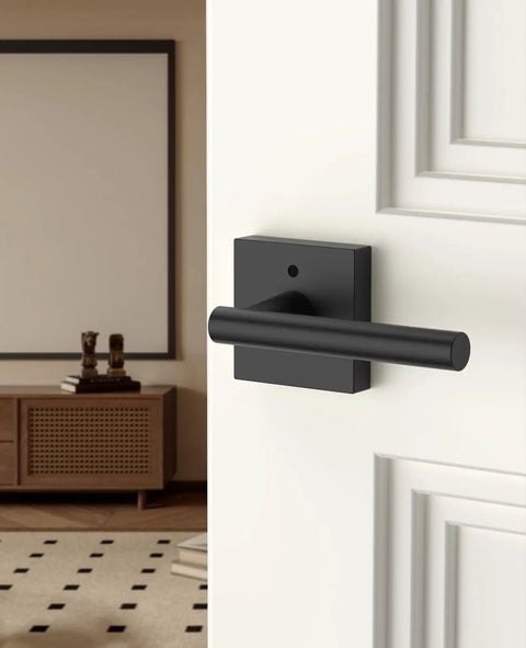 8 Pack Matte Black Privacy Interior Door Handles Featuring Keyless Push Lock Design With No Hassle Emergency Unlatch For Bedroom Bathroom close-up on door handle in modern interior.