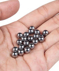 Hand holding 20 chrome steel bearing balls from the 630 Piece Assorted Chrome Steel Bearing Balls Built Damn Tough For Smooth Bicycle Repairs And Precision Machinery Garage Shop Essential Heavy Duty Corrosion Free Sizes.