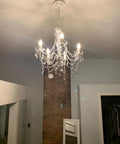 Original Brink House 5 Light Crystal White Chandelier, hardwired flush mount with clear glass stems and acrylic crystals in living room.