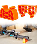 Two Pack Portable Bike Repair Stand With Upside Down Handlebar Holder Height Adjustable Feet Ideal For MTB Gravel Hybrid And Ebike Maintenance Tire Changes Wheel Adjustments And Brake Work showing orange stands holding handlebar.