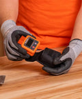 Person using Angle Finder Digital Gauge With Strong Magnetic Base For Quick Conversions Between Degrees, Percent Grade, Inches Per Foot And Millimeters Per Meter, Doubles As Digital Level And Relative Angle Checker For Framing, Landscaping, And Slope Work on workbench.