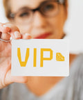 Person holding a white PVC card with 'VIP' printed in yellow; straight up premium white PVC cards 85x54mm for ID badges.