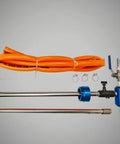 Coolant Blending Mixer Inline Automatic Flow Regulator With Blue Anodized Cylindrical Body Adjustable Control Knob For Machinists And Cnc Shops Heavy Duty Stainless Steel Construction Durable Design with orange hoses and fittings.
