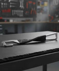 Heavy Duty Stainless Steel Car Door Stopper And Holder With Leather Cover For Parking Ventilation on a workbench.