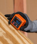 Gloved hand holding an Angle Finder Digital Gauge With Strong Magnetic Base For Quick Conversions Between Degrees, showing 40.0 degrees.