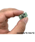 Hand holding Dope Remote Control Switch Module For DC 3V To 12V Motors With Forward And Reverse Stop Mini RF Wireless Controller