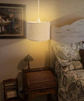 Plug In Pendant Light With 15 Ft Clear Cord Beige Linen Shade On Off Switch Hanging Ceiling Light For Bedroom Living Room Dining Area Cozy Vibe And Easy Height Adjustment displayed over a bedside area with wooden furniture and patterned bedding