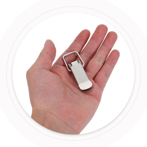 Heavy Duty Four Pack Stainless Steel Spring Loaded Toggle Catches With Flat Mouth Design For Secure Toolbox Latches And Cabinet Locks That Hold Tight All Day Long held in a hand.
