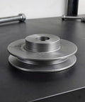 Heavy Duty Single Groove Cast Iron V Belt Pulley Wheel With 19mm Bore And 6mm Keyway for Air Compressors motor shafts on a workstation.